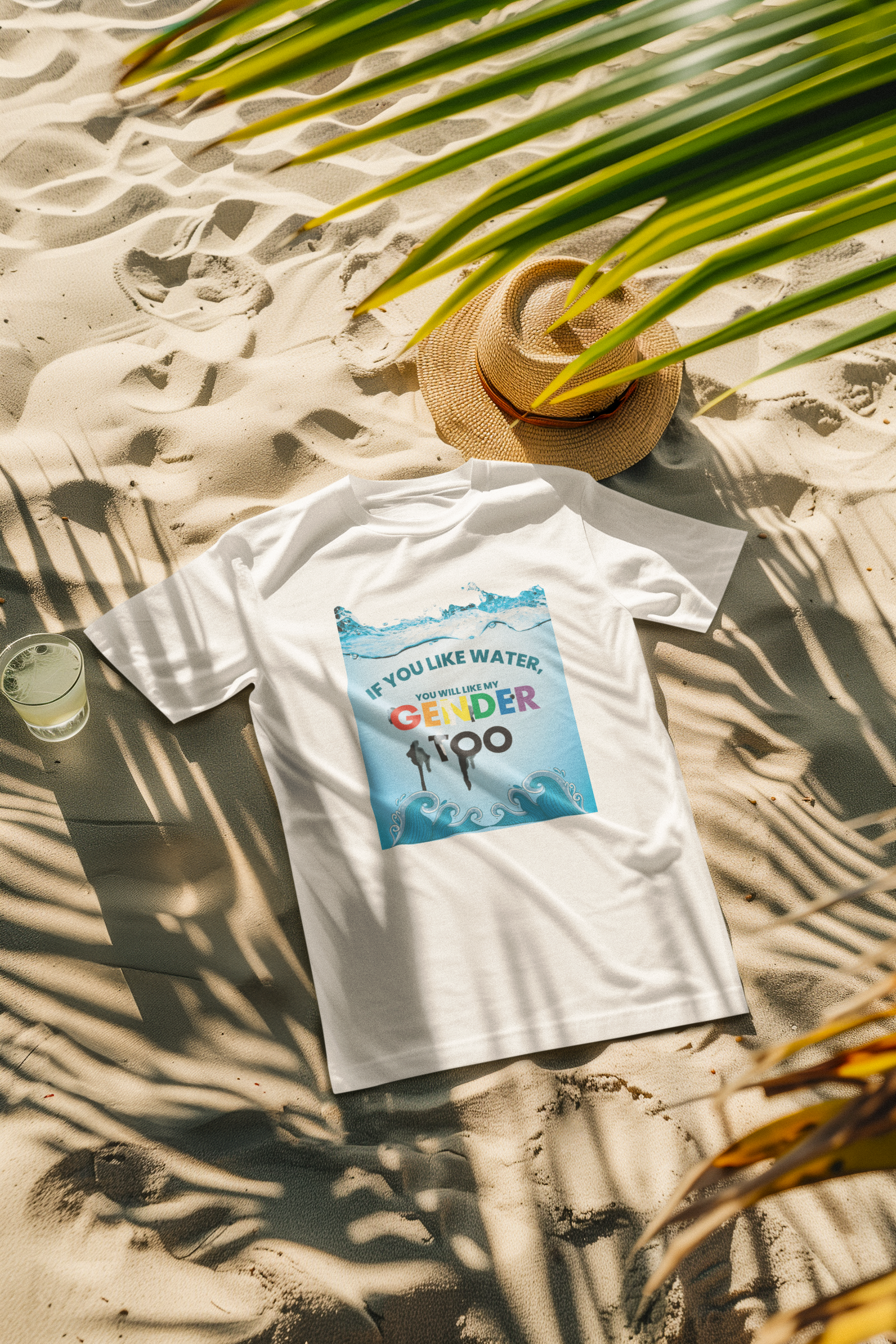White t-shirt styled at the beach, featuring the inclusive phrase "If you like water, you will like my gender too"; fashion-forward statement piece from ANTI’s gender-neutral summerwear.