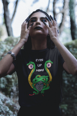 Unisex black T-shirt with contrasting white “Eyes Up Here” print. A sleek, monochrome statement piece designed for Women empowerment, fluid identities, and fearless fashion activism.