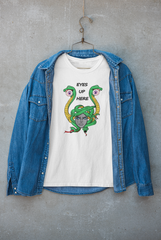 White unisex T-shirt featuring the phrase “Eyes Up Here,” styled under a jacket for a layered, androgynous look. Perfect for Women, bold queer fashion and self-expression beyond binaries.