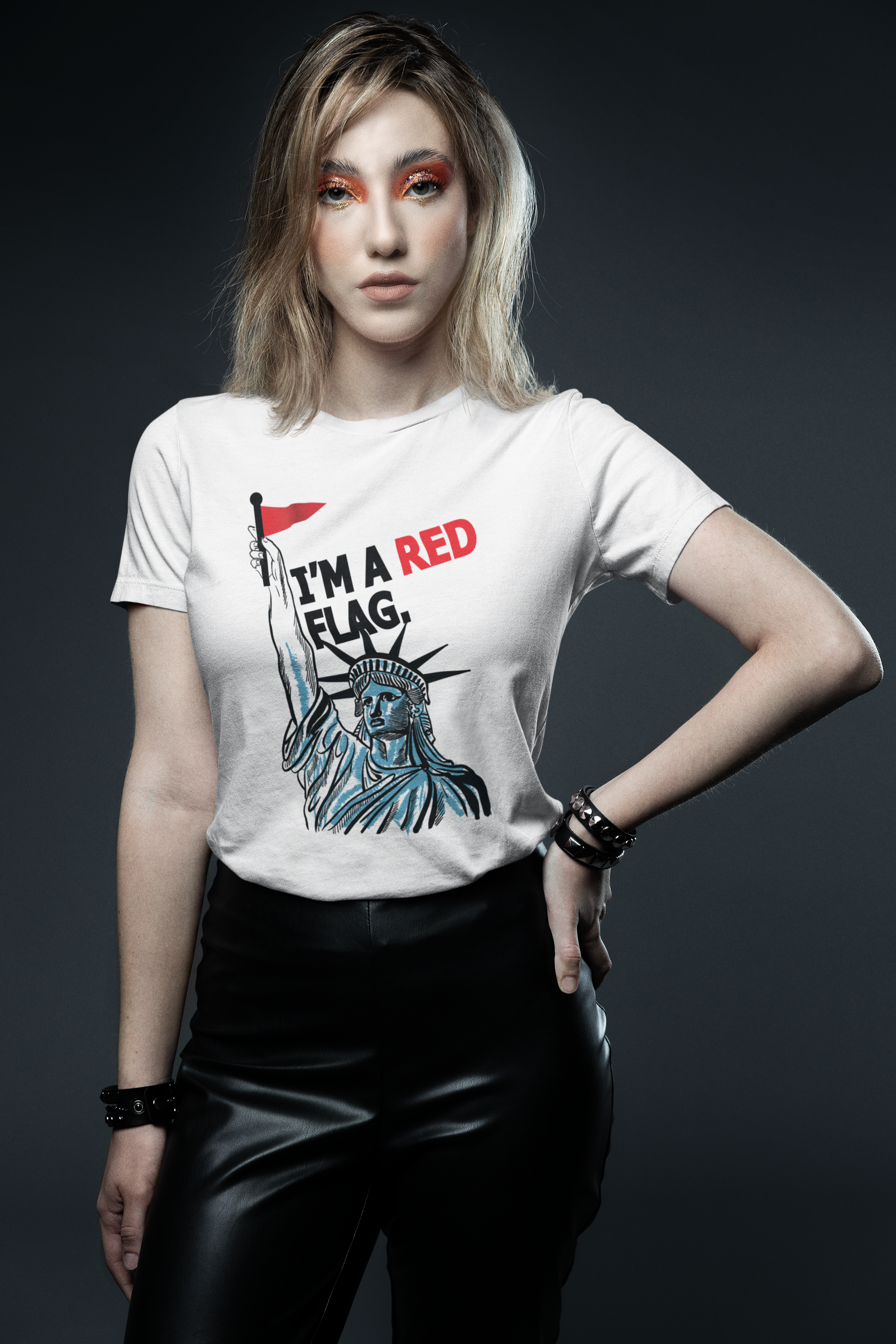 Unisex white t-shirt featuring a bold red “I’M A RED FLAG” print across the front, part of ANTI’s LGBTQIA+ affirming streetwear line championing identity, defiance, and pride.

