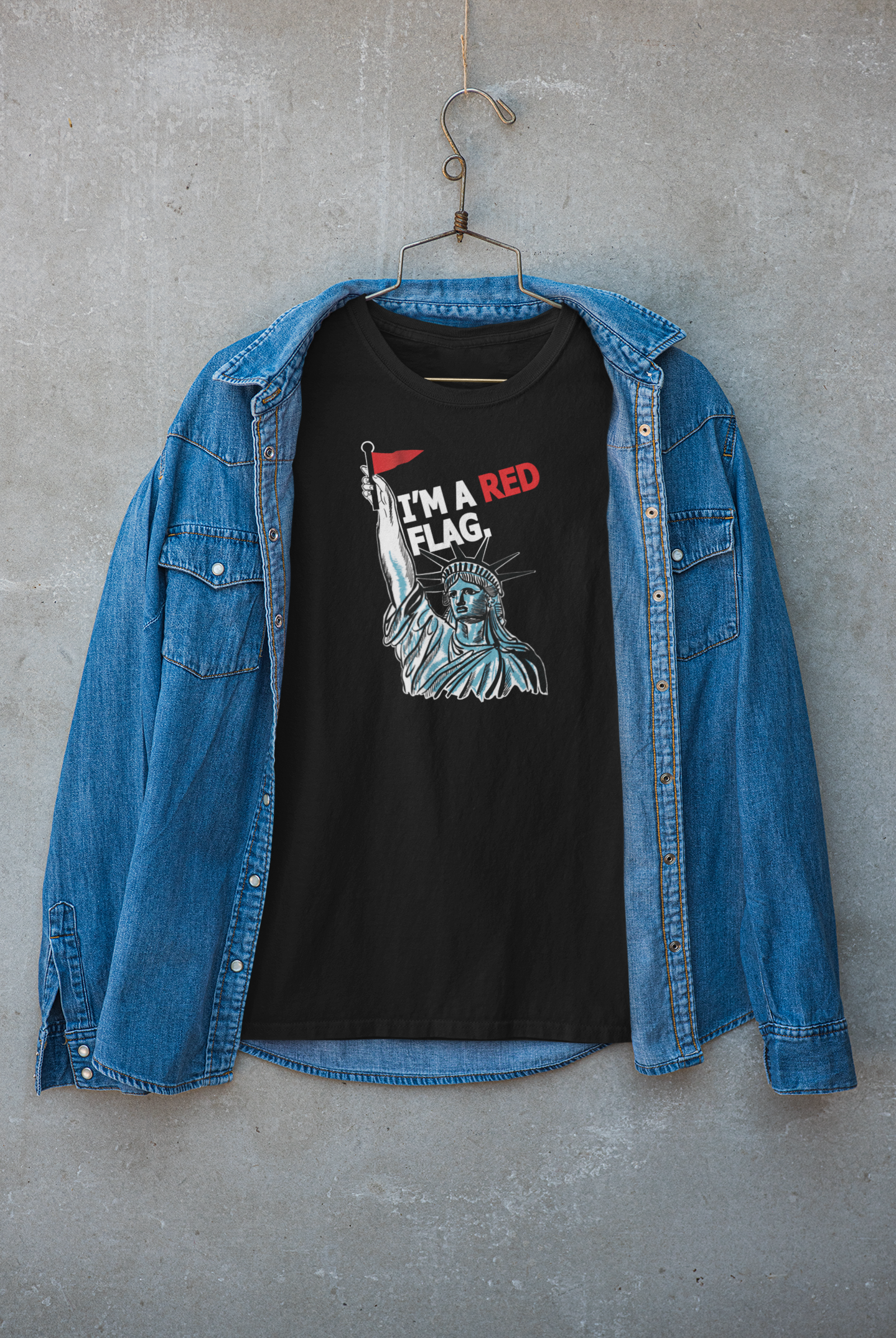 Black “I’M A RED FLAG” unisex t-shirt styled under a jacket, highlighting ANTI’s bold, fluid fashion aesthetic and unapologetic support for LGBTQIA+ self-expression.

