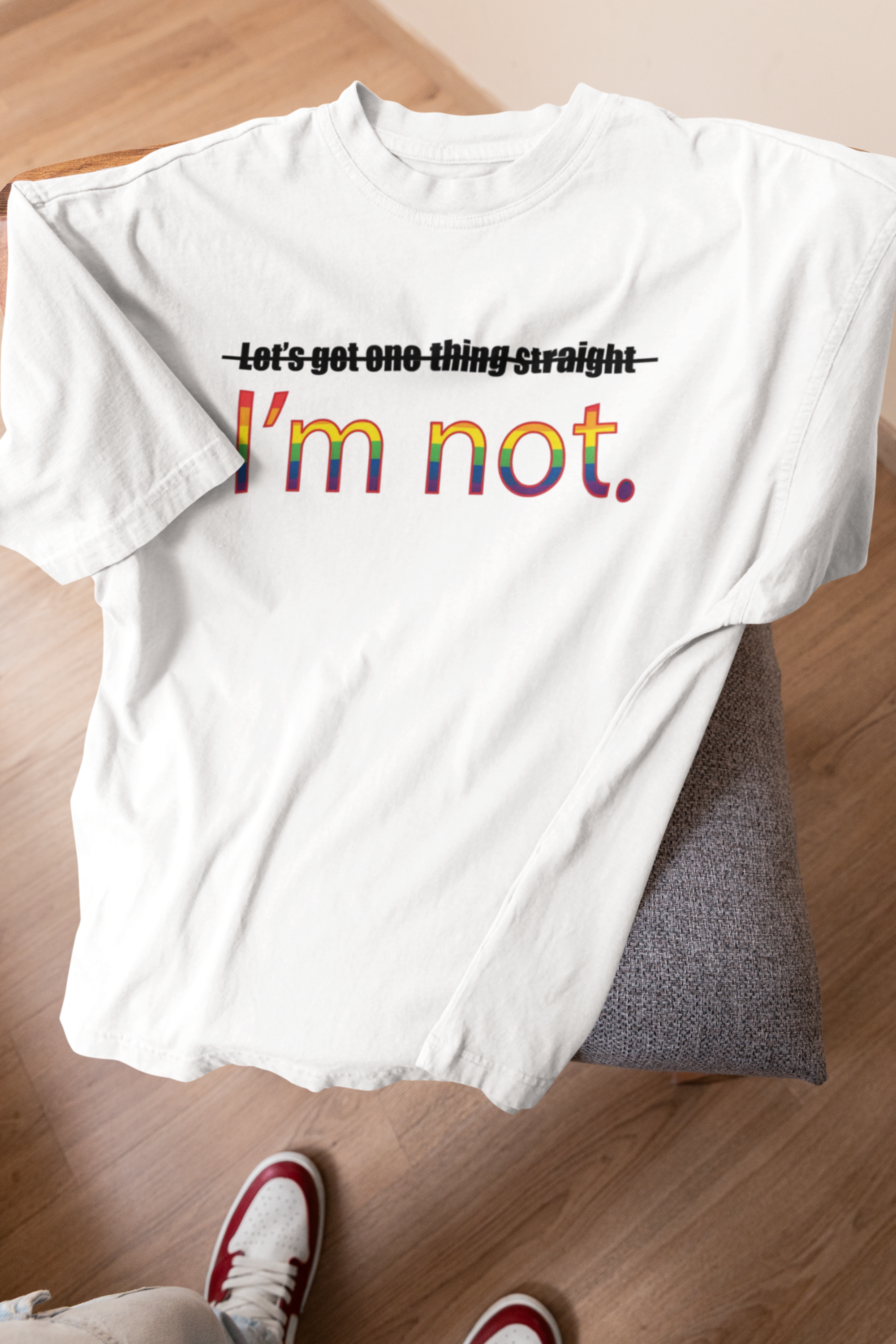 "White oversized ANTI tee with bold queer message – inclusive fashion made for every identity."