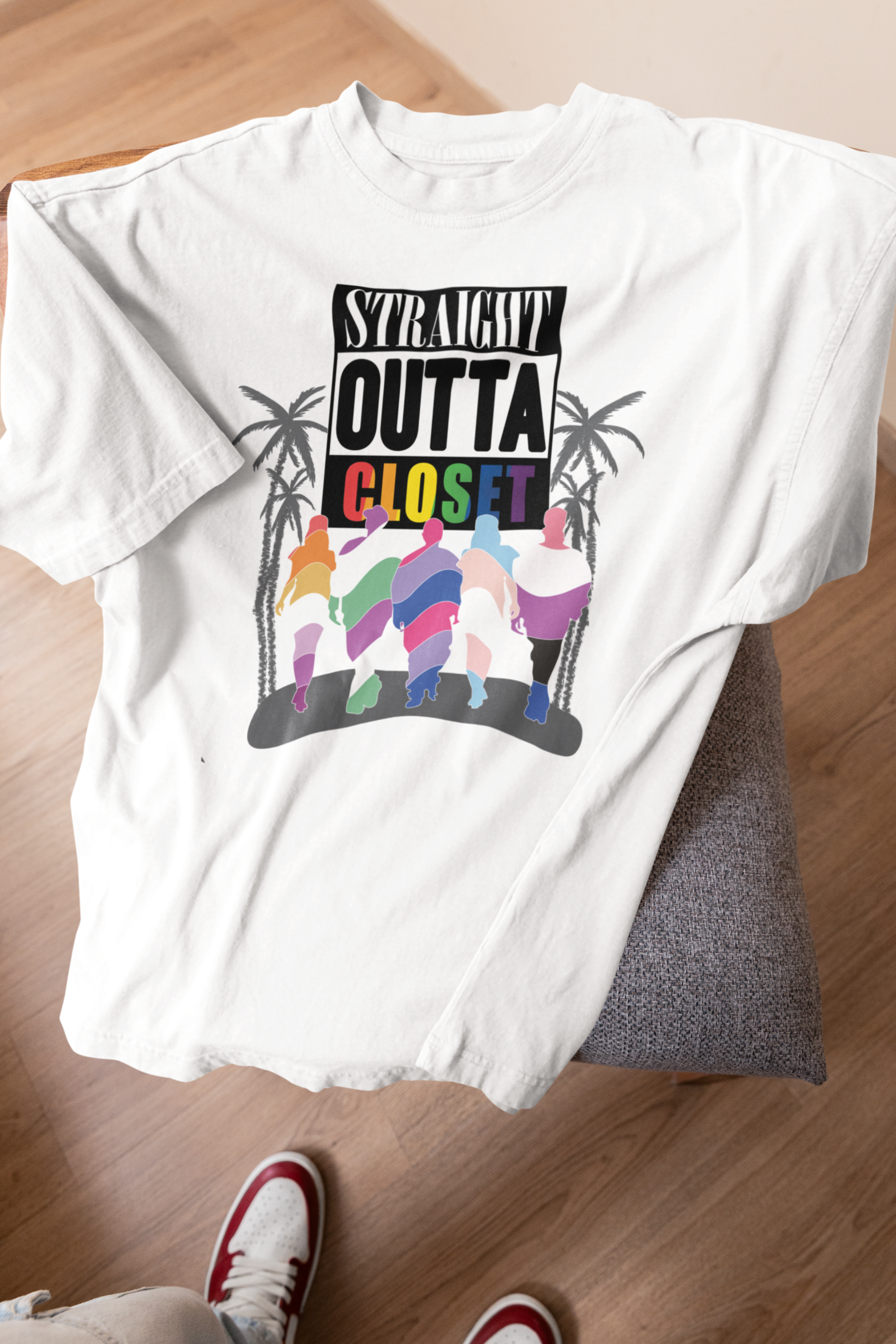 Model posing in the ANTI “Straight Outta Closet” white t-shirt radiating confident queer energy and a relaxed, style that celebrates fluid identity and bold expression.