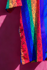 Unisex pastel shirt with soft gradients of pink, blue, and white—evoking the transgender pride flag—with gender symbols printed across the design. A statement piece by ANTI for trans visibility and empowerment.