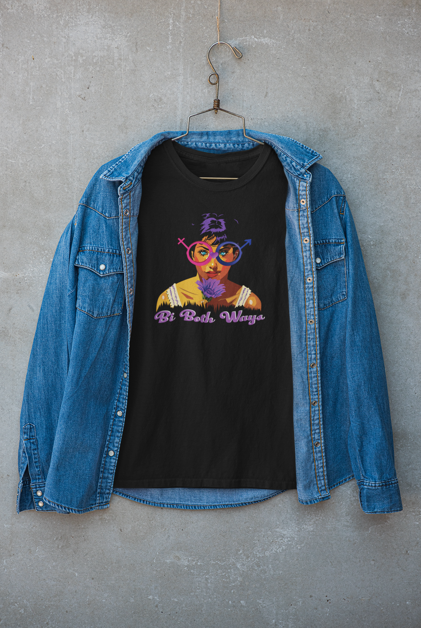 “Stylish woman in black ‘Bi Both Ways’ t-shirt layered with jacket and glasses; edgy LGBTQ+ street style apparel for bisexual pride and inclusive fashion statements.”

