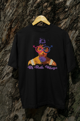 Black Bi Both Ways oversized t-shirt hanging from a tree outdoors, featuring bi pride artwork in a bold, nature-inspired setting.