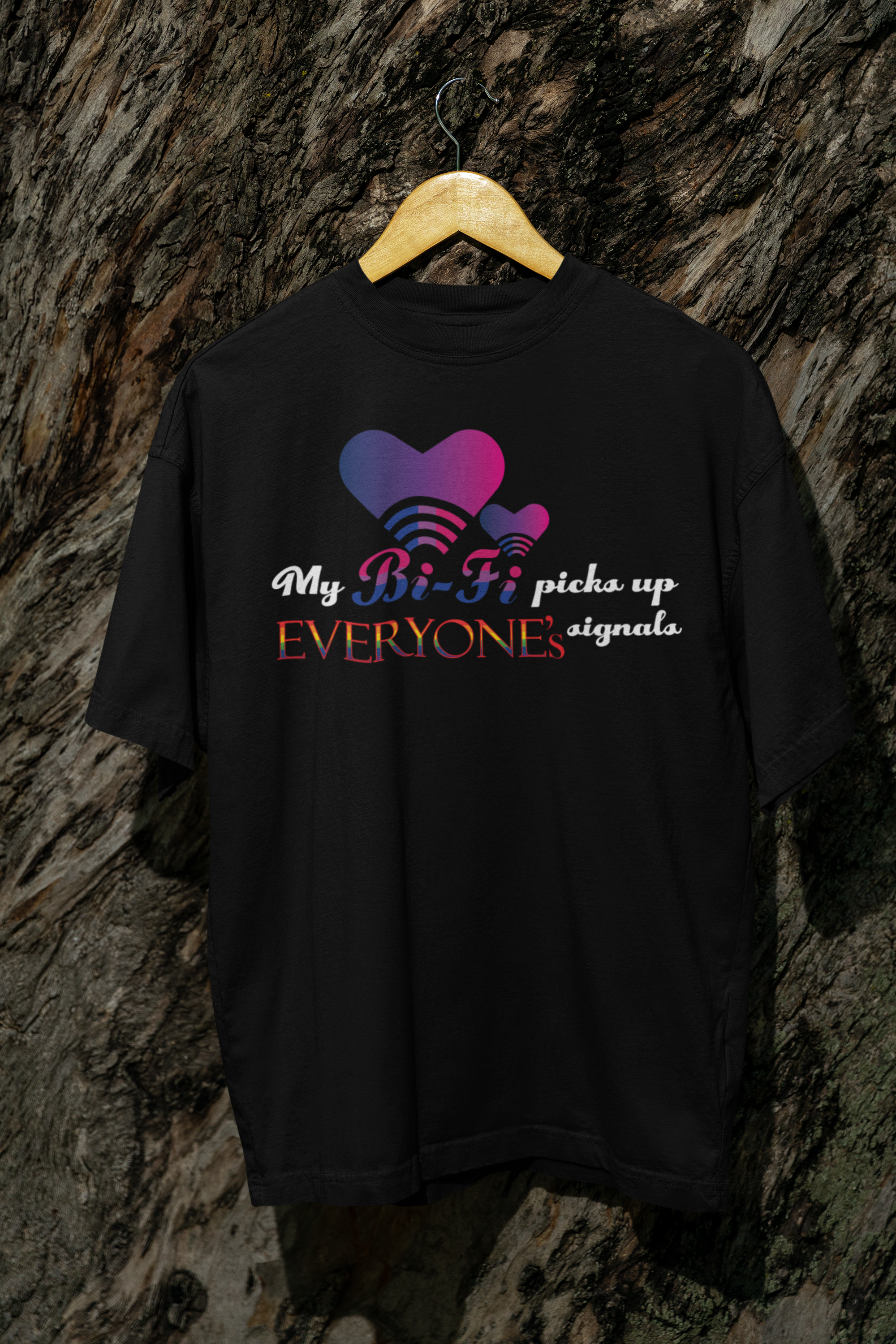 Black oversized graphic T-shirt hanging flat, displaying bold “My Bi-fi” print for bi+ visibility and queer fashion expression.