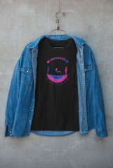 Model wearing a unisex black t-shirt with bold “SWINGING Bi BOTH WAYS” graphic, styled under a jacket; a gender-fluid, bisexual pride fashion piece ideal for streetwear and layered looks.