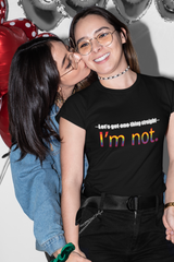 Flat-lay of a black unisex t-shirt with the iconic phrase "LET'S GET ONE THING STRAIGHT, I'M NOT" in crisp white text; designed for LGBTQIA+ visibility and inclusive fashion under the ANTI brand.