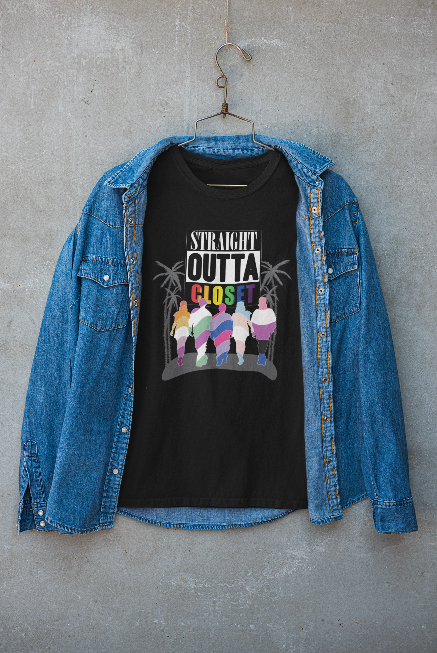 Black t-shirt with “Straight Outta Closet” text layered under a jacket, showcasing urban LGBTQIA+ pride fashion.