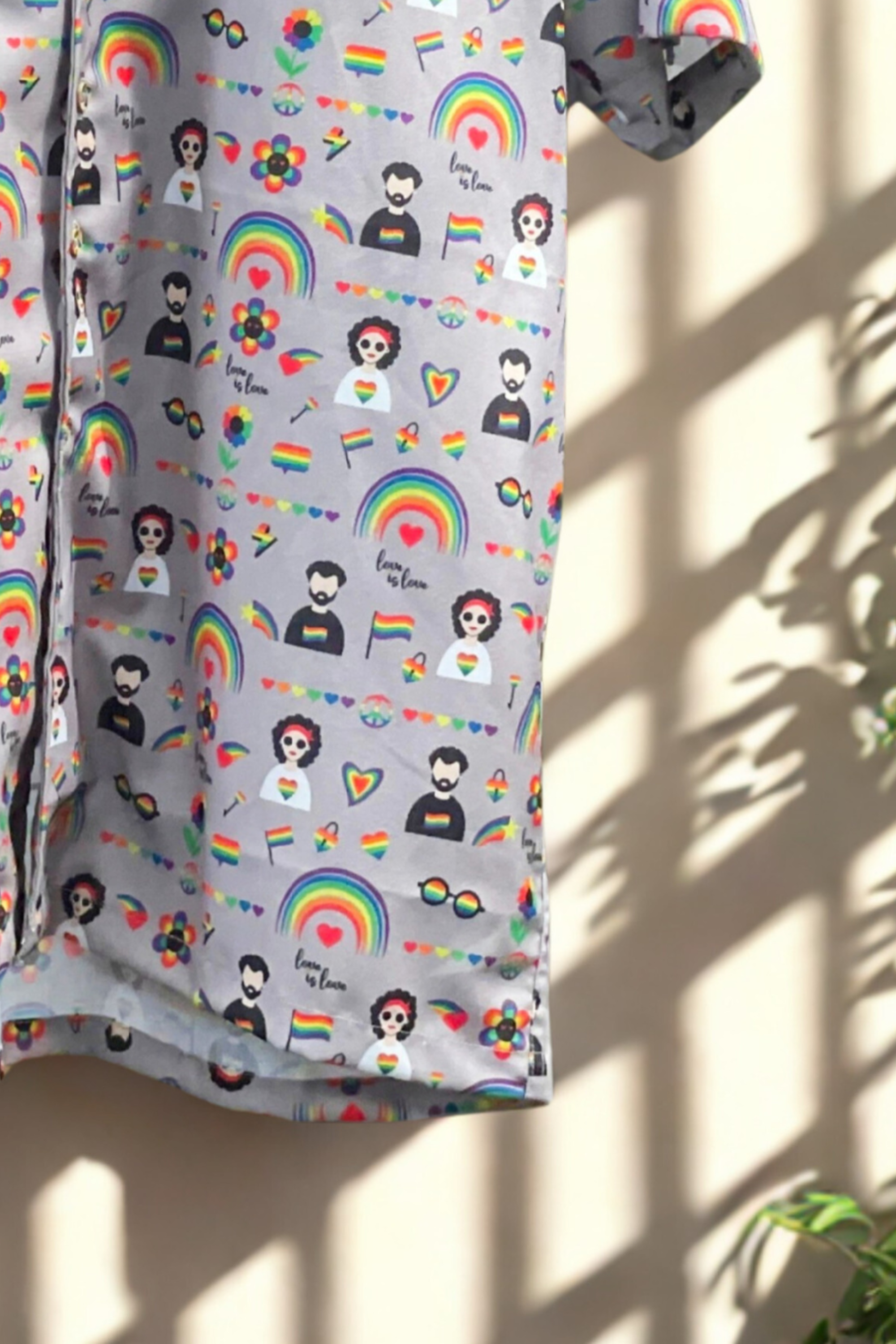 Bottom view of ANTI’s gender-neutral pride shirt with vivid rainbow graphics, inclusive icons, and soft structure, promoting LGBTQIA+ pride and expressive fashion.