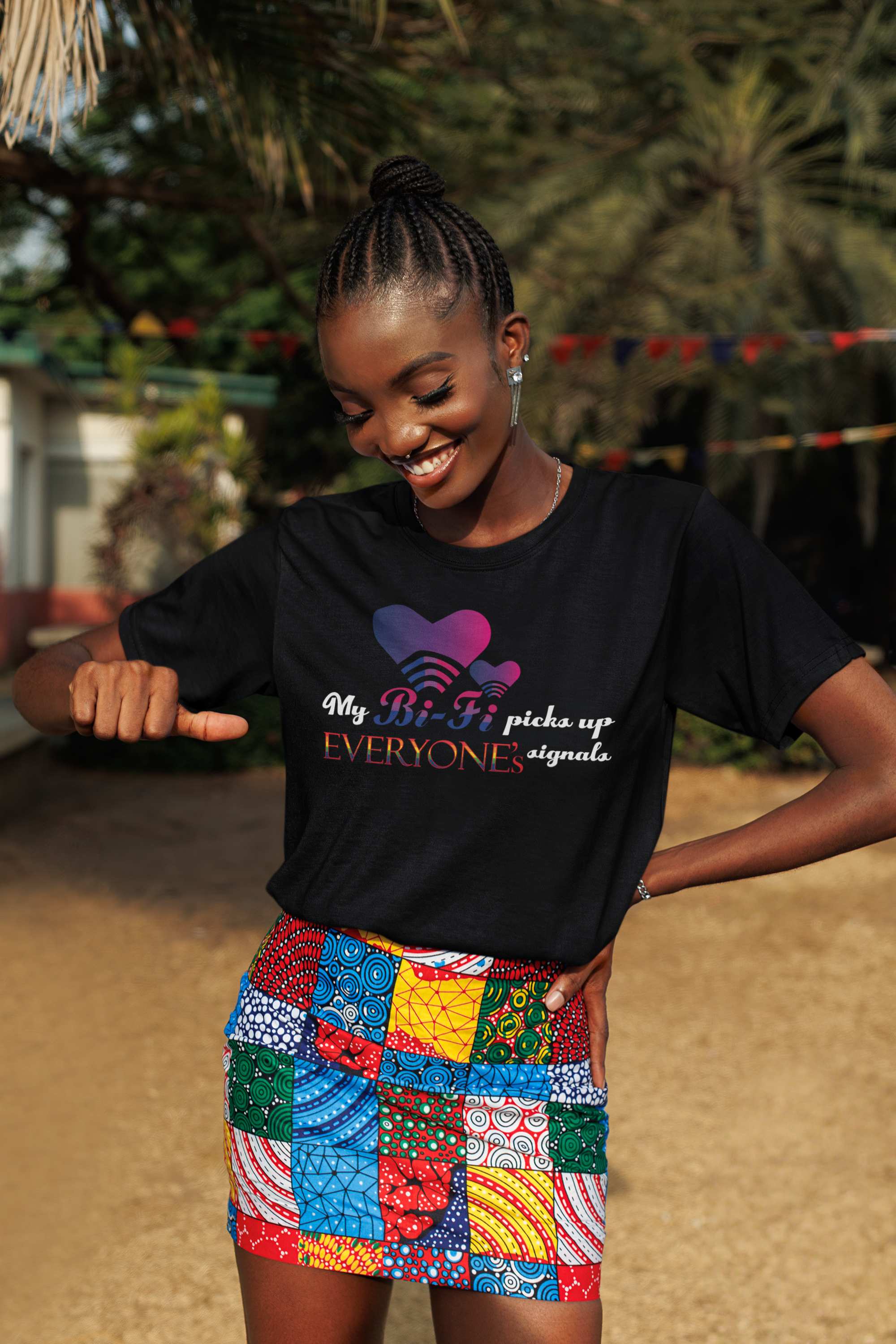 Model wears black oversized T-shirt with “My Bi-fi picks up everyone's signal” slogan, styled for bold, gender-inclusive streetwear.