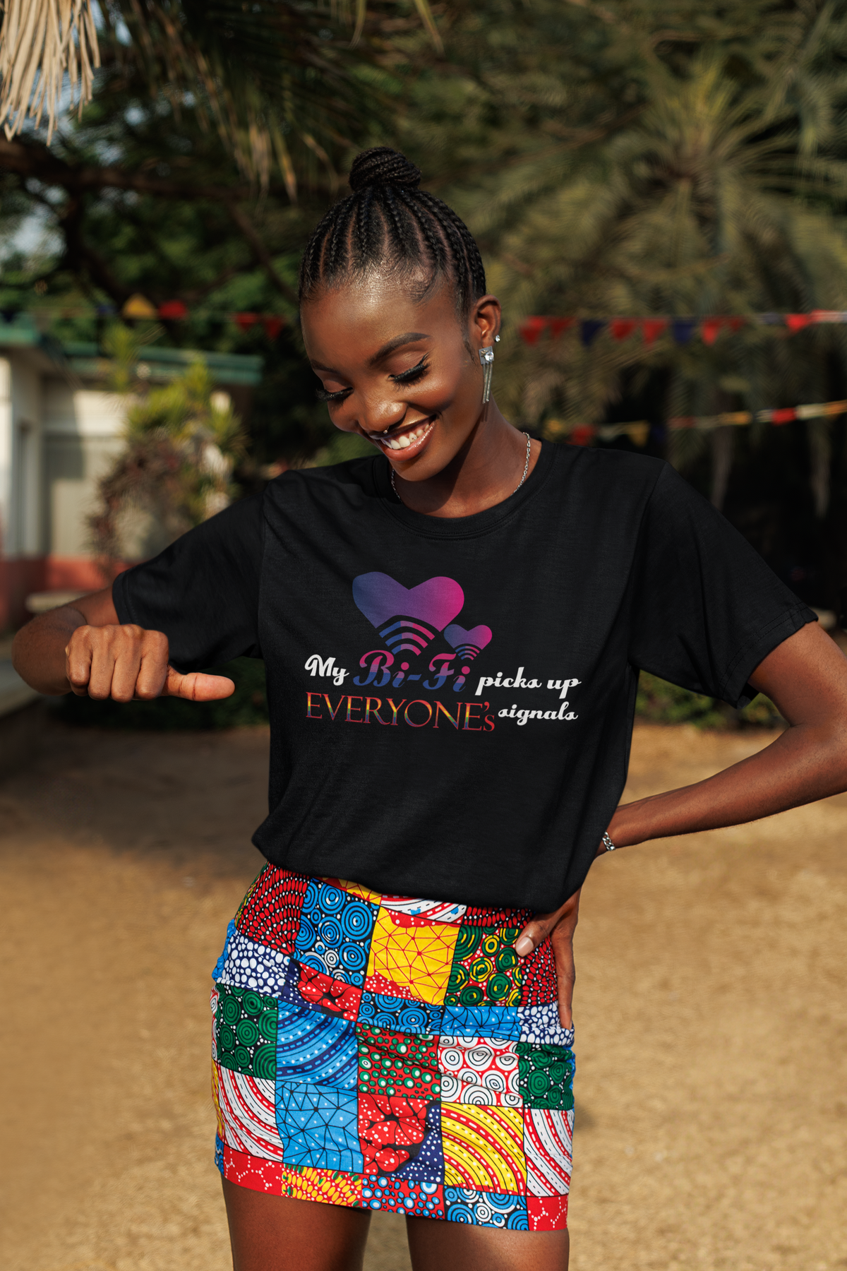 Model wears black oversized T-shirt with “My Bi-fi picks up everyone's signal” slogan, styled for bold, gender-inclusive streetwear.