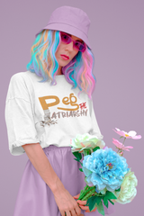 White oversized t-shirt with bold “Peg the Patriarchy” text. This unapologetic feminist tee is a symbol of resistance and women's empowerment, designed in a relaxed, gender-inclusive silhouette that speaks to strength, equality, and reclaiming power.