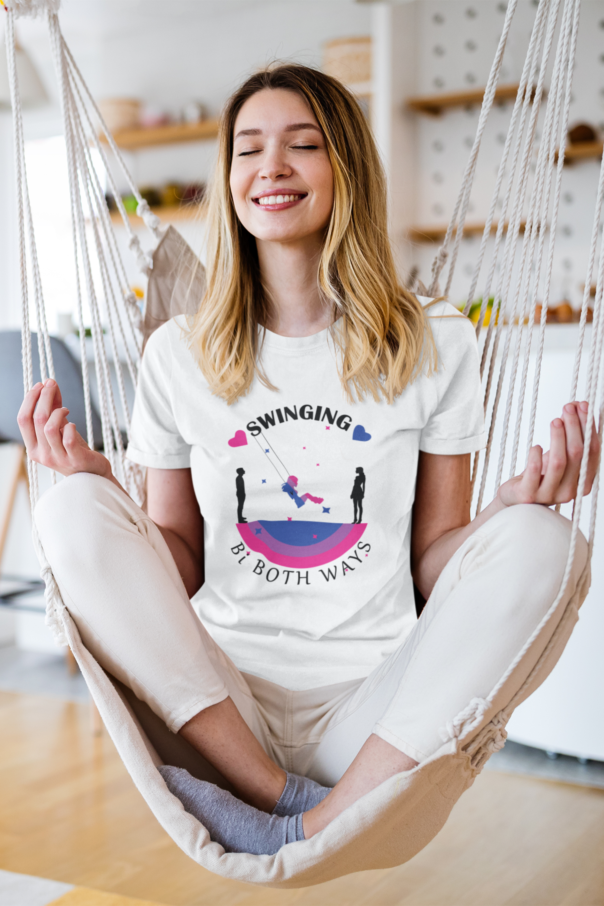 Close-up view of white t-shirt with “SWINGING Bi BOTH WAYS” text; inclusive and empowering LGBTQIA+ slogan in a clean, minimalist fashion style.