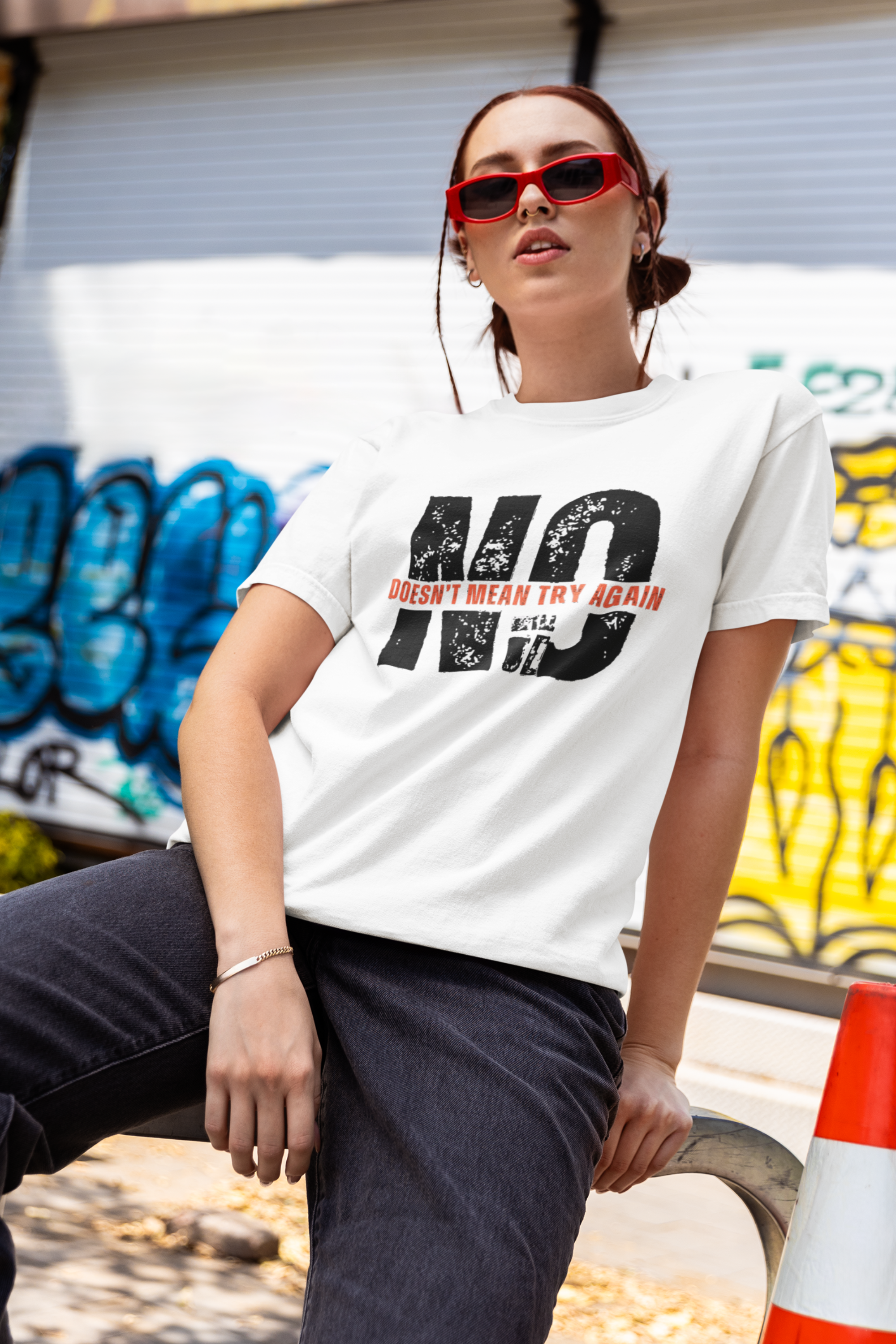 White feminist slogan tee on queer femme model, oversized fit, inclusive and rebellious, styled with edge and ease