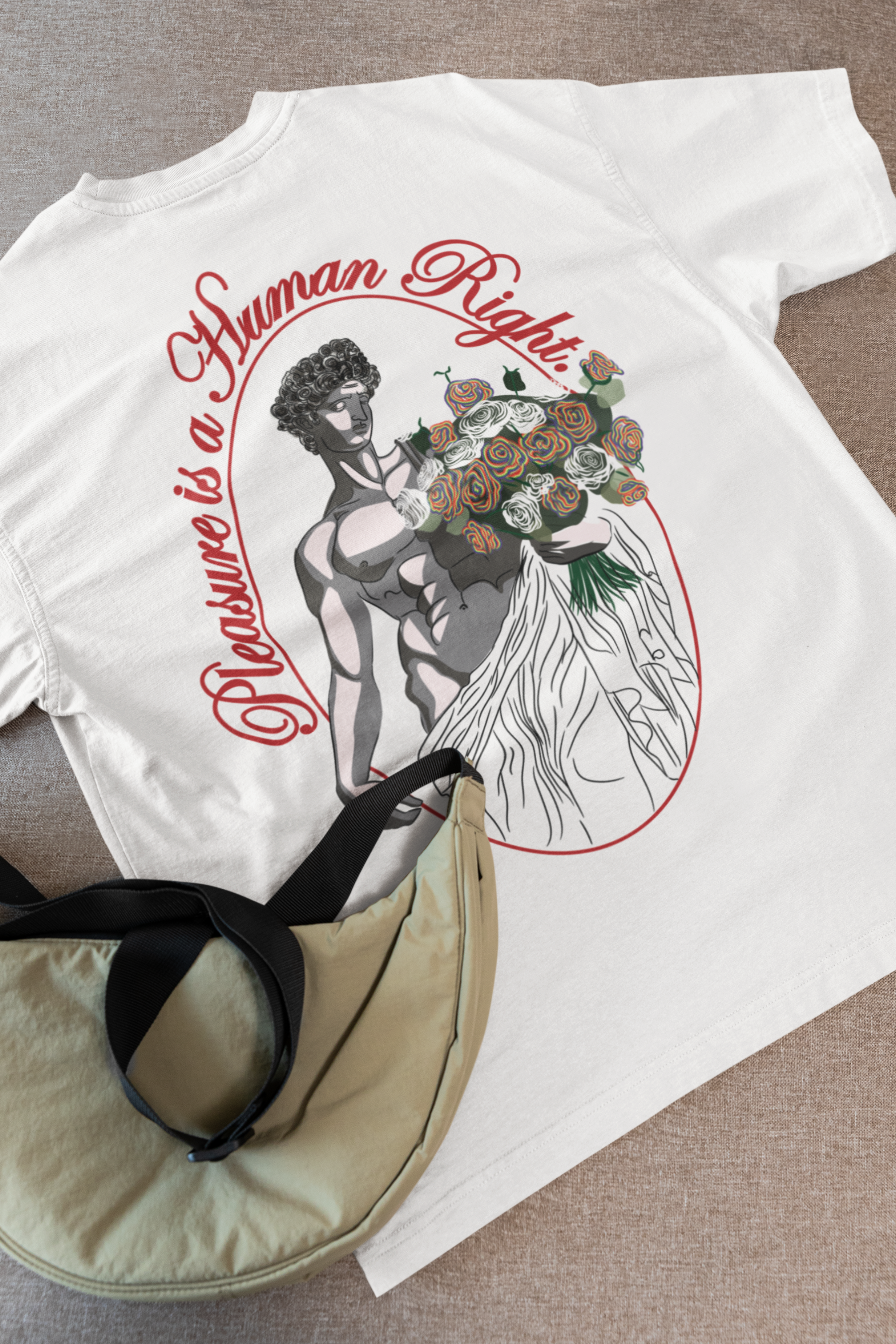 Flat lay of white oversized tee with black “Pleasure is a Human Right” text—bold, gender-free, and proudly LGBTQIA+ inclusive.