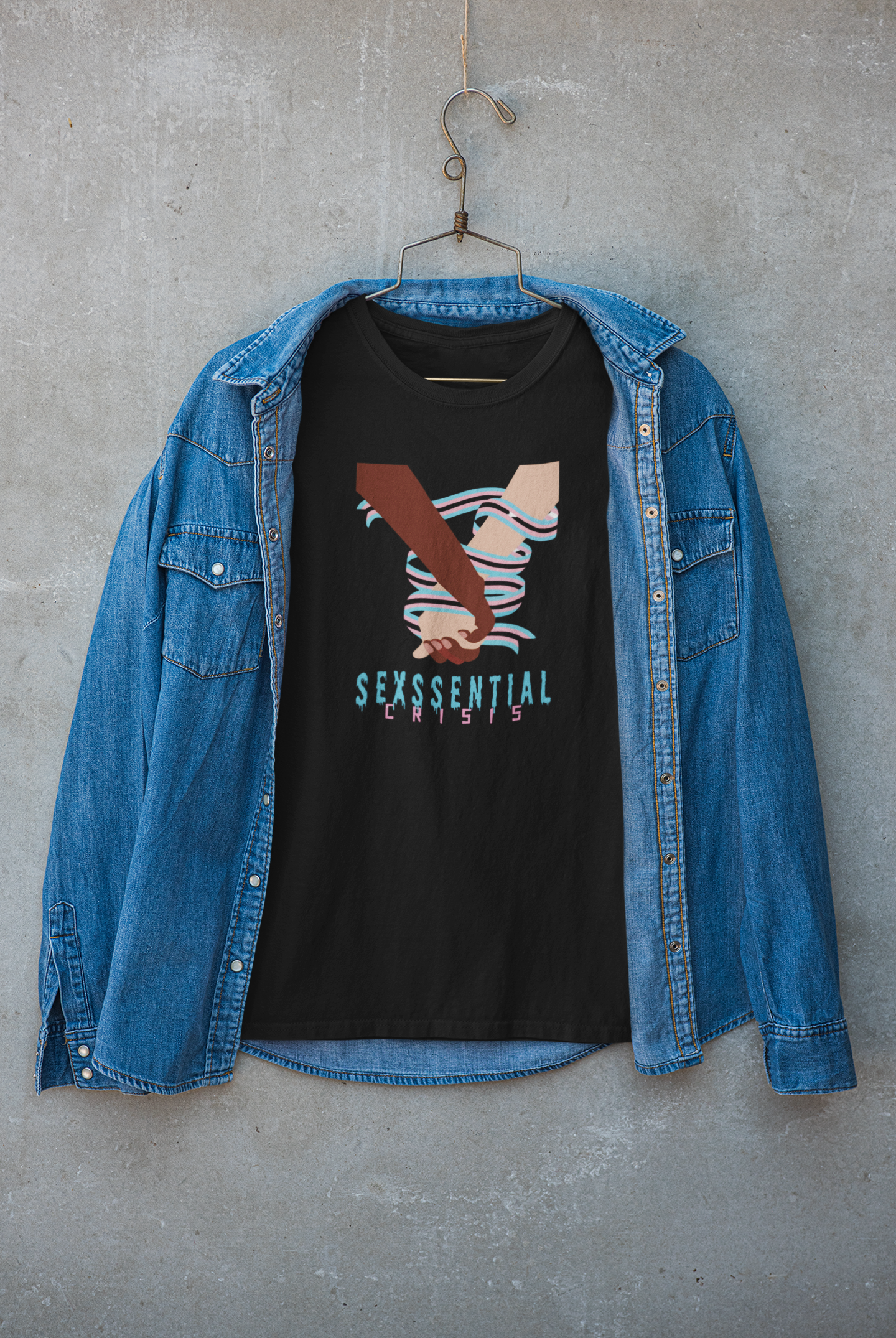 “ANTI black T-shirt featuring the ‘Sexssential Crisis _ 2 Hands’ graphic, worn beneath a casual jacket. Street fashion layered styling with rebellious tone and clean typography.”