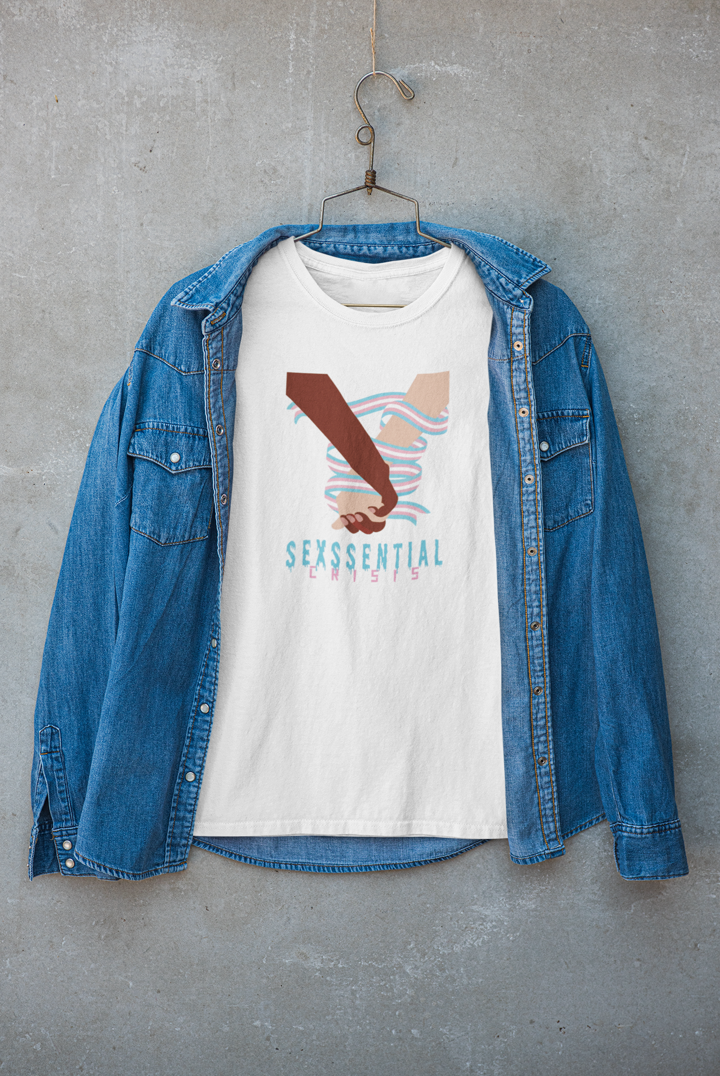 “White graphic T-shirt from ANTI’s ‘Sexssential Crisis _ 2 Hands’ collection, styled under a streetwear jacket. A modern, layered urban fashion look ideal for cooler seasons.”

