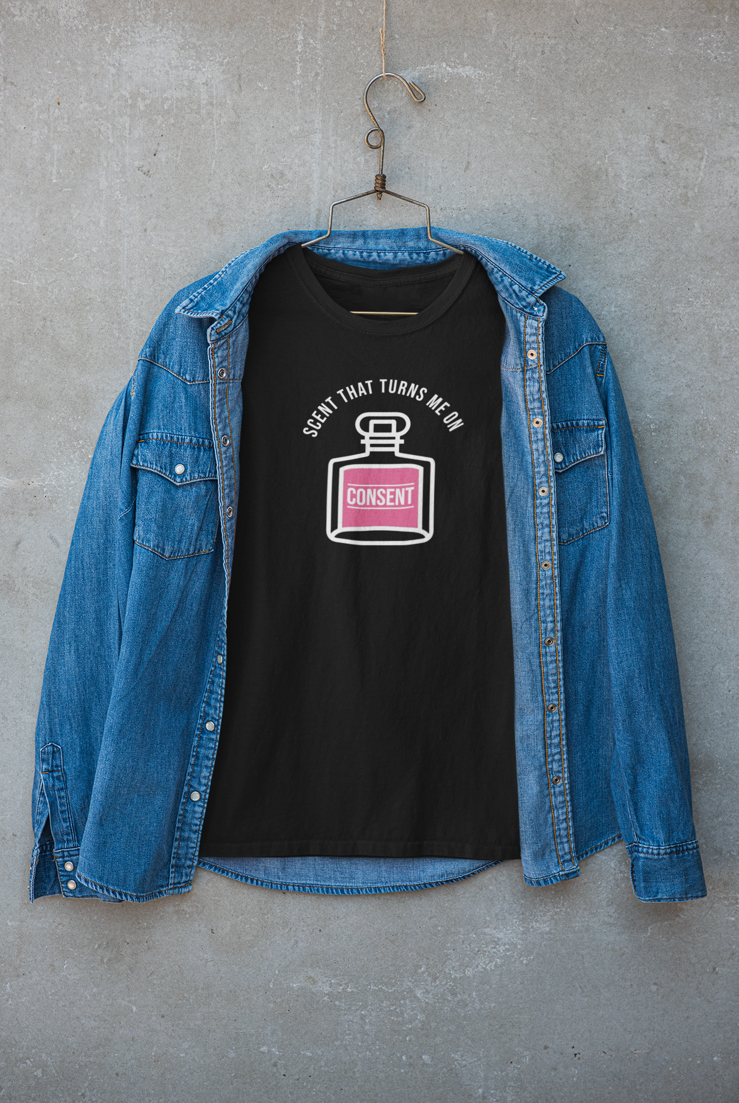 "Black T-shirt designed for urban layering, featuring bold text 'Scent That Turns Me On' – sleek streetwear with attitude."

